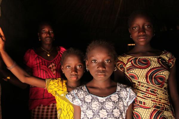 A woman and her daughters stand in their home, in the village of Cambadju in Bafatá Region. Their village is the first in the country to renounce female genital mutilation/cutting (FGM/C). The harmful traditional practice, which can result in irreversible, life-long health and other complications, as well as psychological harm, was renounced in the village that same day, during a ceremony organized with support from the international NGO Tostan, a UNICEF partner. The event was attended by girls and young women, former traditional cutters, delegates from youth and women’s groups, government officials and others. Between 2006 and 2010, the percentage of girls and women aged 15 to 49 years of age subjected to FGM/C in Guinea-Bissau increased from 45 per cent to 50 per cent – and reached 94 per cent in eastern parts of the country. Together with Tostan and other partners, UNICEF supports interventions that help communities decide for themselves to renounce the practice.

In November/December 2012 in Guinea-Bissau, a vaccination campaign against measles was held as part of an effort by the Government and the Measles & Rubella Initiative, a multi-partner effort led by the American Red Cross, the United Nations Foundation, the United States Centers for Disease Control and Prevention (CDC), the World Health Organization (WHO) and UNICEF. In Guinea-Bissau, political instability and deep poverty continue to contribute to limiting economic and social development. The country has the seventh-highest under-five mortality rate in the world, despite a decline (from 210 to 161 deaths per 1,000 live births) from 1990 to 2011, and maternal mortality is also high. One-third of the population and half of all rural inhabitants lack access to safe water. More than 80 per cent of the population have no access to sanitation. Cholera continues to be endemic, and HIV prevalence is 5.3 per cent among adults, with women disproportionately affected. Wide economic, gender and other dispar